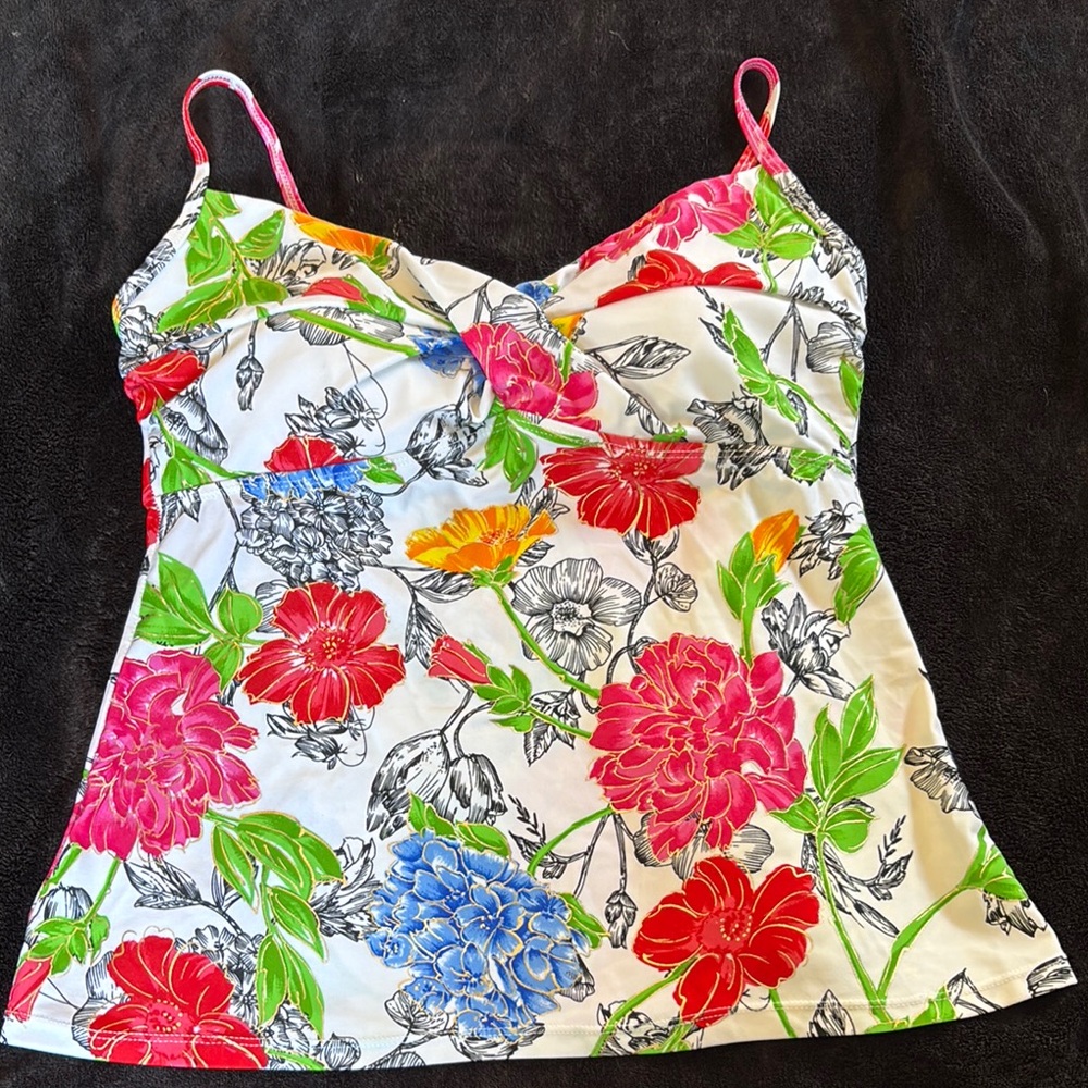 white swimsuit with a colorful floral pattern.